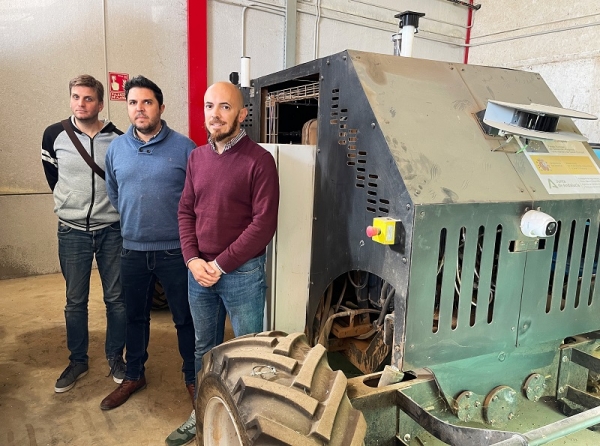 The research team next to the autonomous tractor